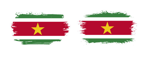Set of two grunge brush flag of Suriname on solid background