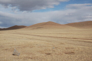 The quiet spring in the huge meadow, Zavkhan, Mongolia. The spring in Mongolia is short, but is cold. The rivers and creeks are still frozen. The steppe wind often blows stronger and colder. 