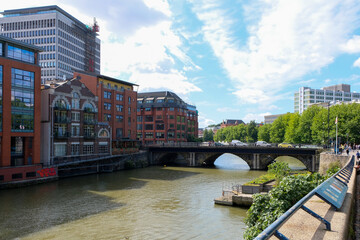 Bridge over the River Avon lined by architecturally designed offices converted from old dock warehouses in city centre of Bristol, Southwest England, UK - obrazy, fototapety, plakaty