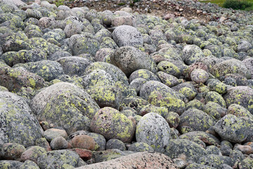 Large round stones on the beach of sea
