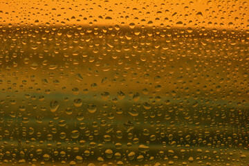 The effect of rain on a colored background.