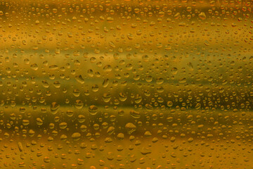 The effect of rain on a colored background.