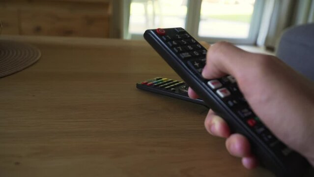 Agressively zapping to other channels on the tv with the tv controller