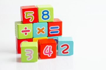 Number wood block cubes for learning Mathematic, education math concept.