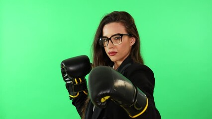 Long hair brunette woman office secretary in formal business office suit and boxing gloves react to work stress punching. Slow motion - Powered by Adobe