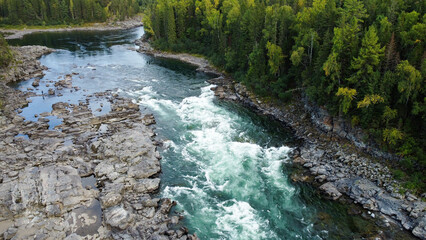 Wild nature landscape drone view with river and forest. Fog above water. Mountain Siberian river flow, water on stones,  forest  trees. aero view.