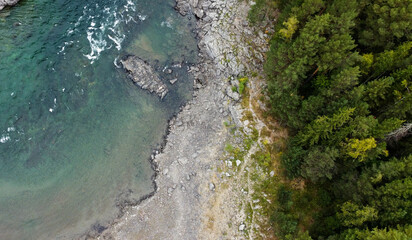 Wild nature landscape drone view with river and forest. Fog above water. Mountain Siberian river flow, water on stones,  forest  trees. aero view.