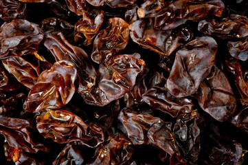 Close-up shot of freshly dried dark-colored raisins.