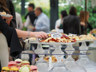 people self serve catering buffet finger food indoor in luxury location in Italy