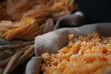 Different varieties of pasta are collected in wicker baskets