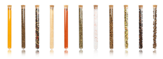 Set of glass tubes with different spices on white background. Banner design