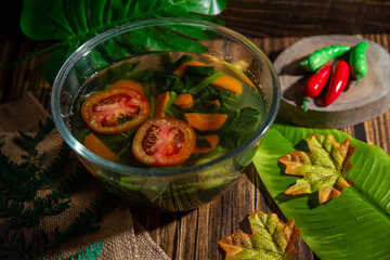 A bowl of clear spinach soup