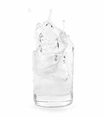 Shot of vodka with ice and splash isolated on white