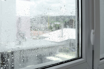Window glass with water drops, closeup. Condensation - obrazy, fototapety, plakaty