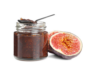 Glass jar of tasty sweet fig jam and spoon isolated on white
