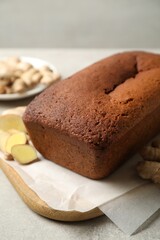 Delicious gingerbread cake on light grey table