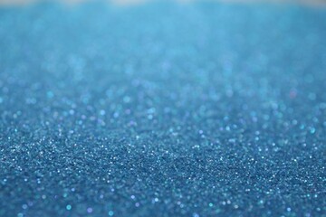 Shiny light blue glitter as background. Bokeh effect