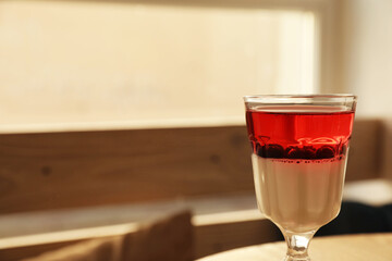 Delicious panna cotta dessert with berries against blurred background, closeup. Space for text