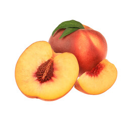 Whole and cut delicious peaches with green leaves isolated on white