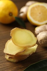 Naklejka na ściany i meble Cut ginger and lemon on wooden table, closeup