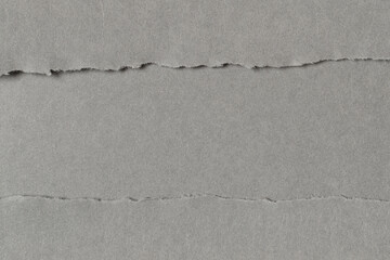 Gray cardboard paper background. Full frame texture.