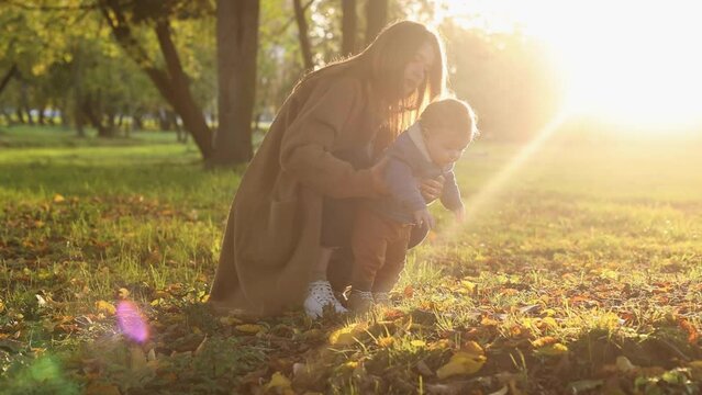 mother and son in the park first steps