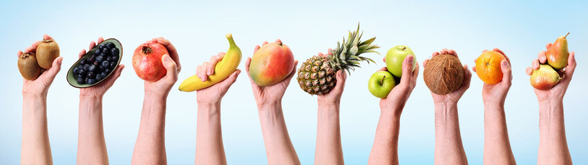 Fototapeta Unrecognizable people holding assorted fruits obraz