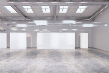 Modern concrete exhibition hall interior with empty white mock up banners and sunlight. 3D Rendering.
