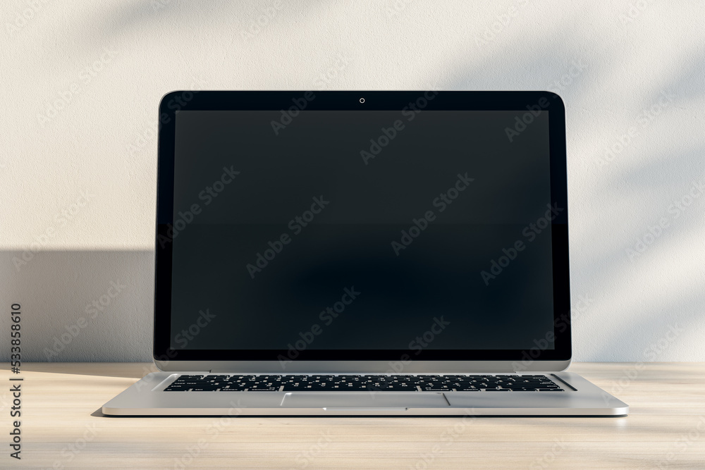 Aufkleber Close up of notebook with empty screen and mock up place at wooden workplace with shadows. 3D Rendering.