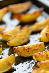 homemade potato wedges on a baking sheet