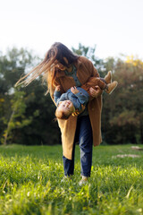 mother and son in the park first steps