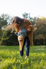mother and son in the park first steps