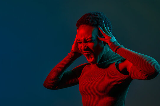 Headshot portrait of young woman shouting