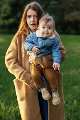 mother and son in the park first steps