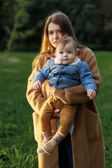 mother and son in the park first steps