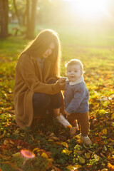 mother and son in the park first steps