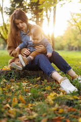 mother and son in the park first steps
