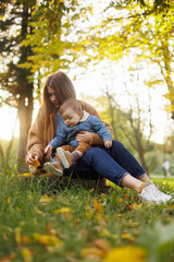 mother and son in the park first steps