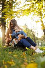 mother and son in the park first steps