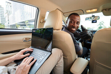 Taxi Driver Turning Back to Passenger