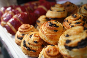 Freshly baked sweet buns with raisins.