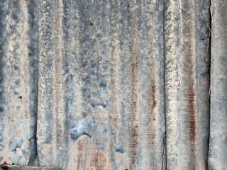 Close-up shot of pattern and texture of old metal sheet roof.
