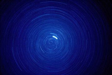 Long shot star trail under blue sky