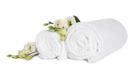 Clean soft towels with flowers isolated on white