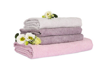 Stack of clean soft towels with flowers isolated on white