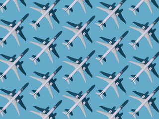 Fototapeta na wymiar Airplane background. Flights, travel and aviation. Pattern of white planes on a blue background. The passenger plane is flying. Air transport concept.