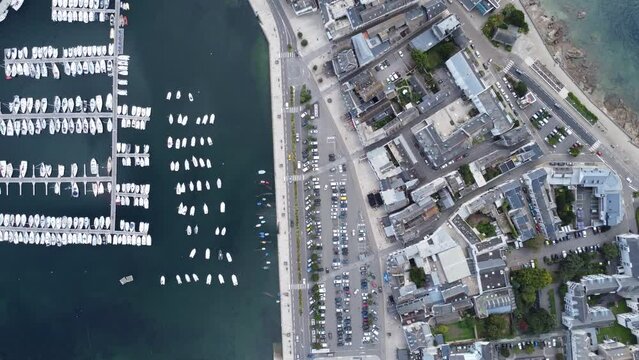 the port of concarneau in brittany (france), droneshot filmed from above, sunny weather