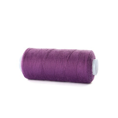 Spool of purple sewing thread isolated on white