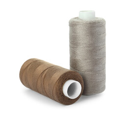 Different colorful sewing threads on white background
