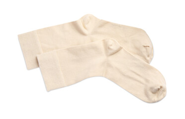Pair of beige socks on white background, top view